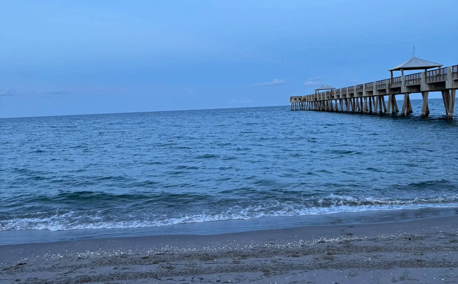 The Juno Beach pier at dusk